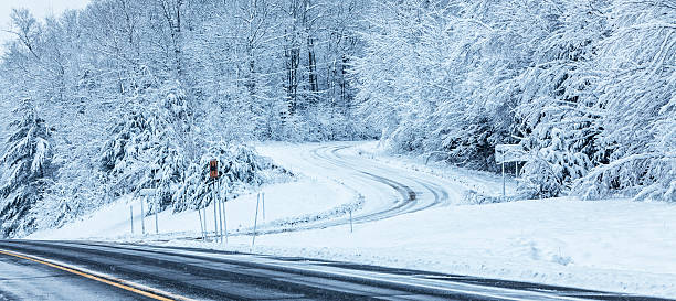 istock Winding Adirondacks Country Road Intersection During Blizzard Snow Storm 503361920