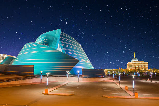 Astana, Kazakhstan - August 17, 2013: located in the administrative center, unique in its architectural design and Presidential PalacePanorama of Singapore skyline illuminated in the evening twilightAstana, Kazakhstan - August 17, 2013: located in the administrative center, unique in its architectural design and Presidential PalacePanorama of Singapore skyline illuminated in the evening twilight