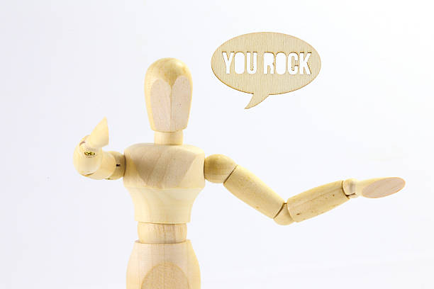 istock Wooden puppet You Rock   word 503364262