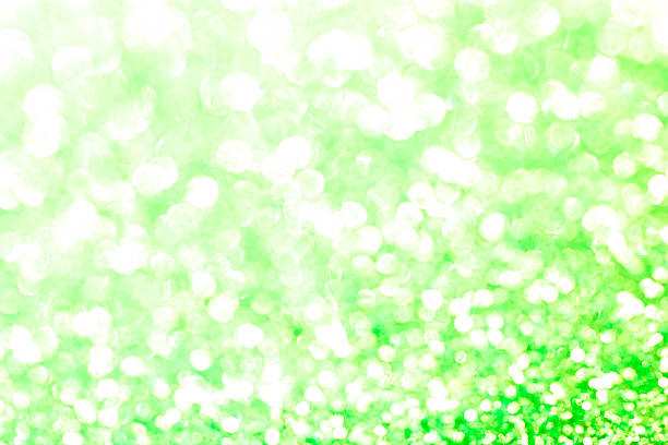 istock Green bokeh texture. Festive glitter background with defocused 503364264