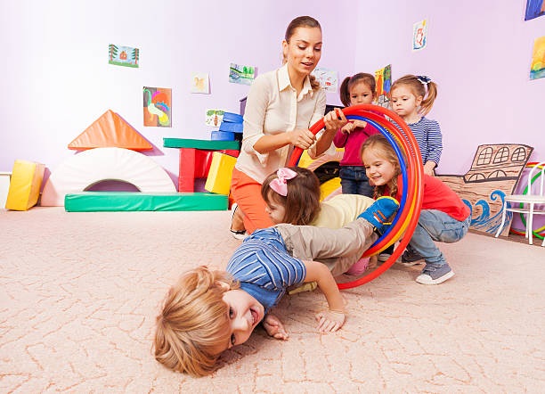 istock Fun with hoop on the kindergarten class 503365468