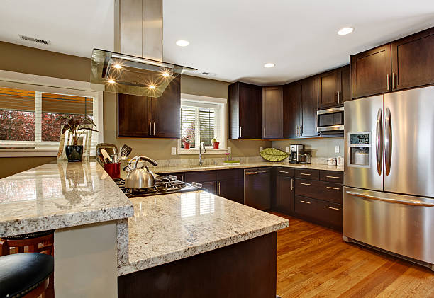 istock Dark brown kitchen room with steel appliances 503373157