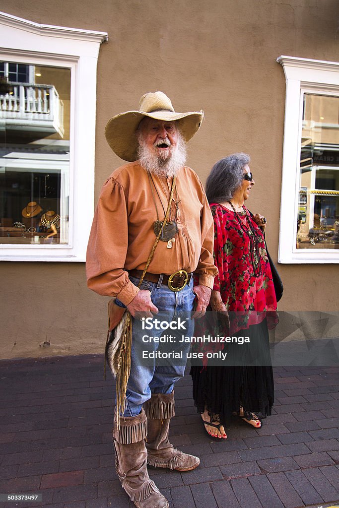 Vistors at the 2014 Spanish Market, Santa Fe, NM Santa Fe, USA - July 27, 2014: Two market-goers at the 63rd Annual (2014) Spanish Market in Santa Fe, NM. 2014 Stock Photo