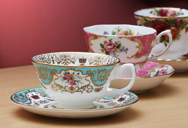Vintage China Vintage china tea cups on a wooden table tea cup and saucer stock pictures, royalty-free photos & images