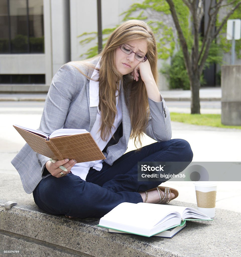 Stressed student studying on campus Woman university student studying on campus 20-29 Years Stock Photo