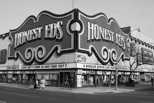 Toronto, Canada - May 13, 2014: The outside of the Honest EDS Department Store along Bloor Street during the day. People can be seen on the street.