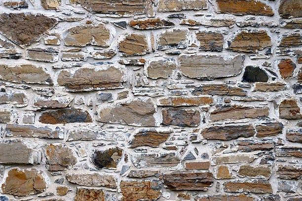 istock Grunge stone wall filled with cement 503377153