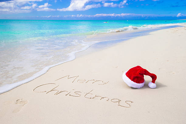 istock Merry Christmas written on beach white sand 503386324