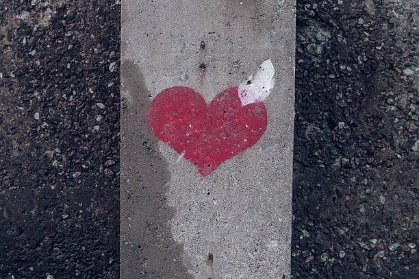 istock Heart symbol painted on a concrete wall 503386464