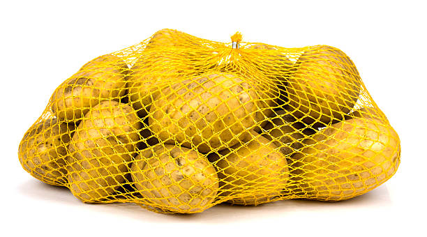 istock bag of fresh potatoes isolated on white 503390238