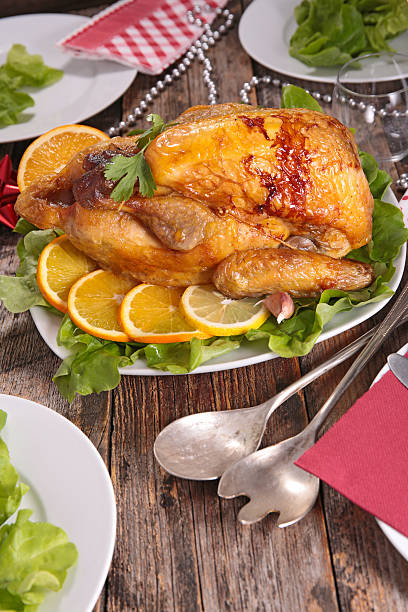 istock table with guinea fowl cooked with orange 503390392