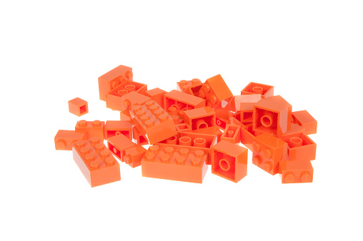 Adelaide, Australia - January 03, 2016: A studio shot of orange lego pieces, isolated on a white background. Lego is very popular with children and collectors worldwide.