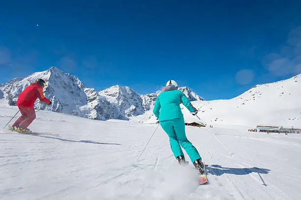 skiinig at ski lodge-  prepared piste and sunny day