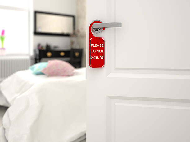 istock Do not disturb sign on a hotel room door 503399384