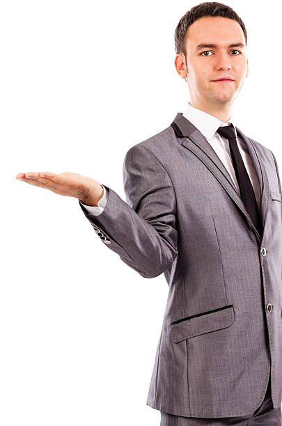 istock Young business man standing with an open hand 503399737
