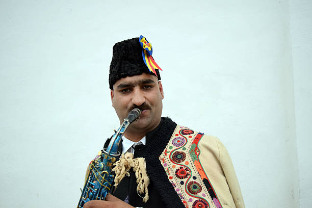 istock Gipsy singing traditional Romanian carols at saxophone. 503399768