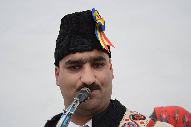 Gipsy singing traditional Romanian carols at saxophone.