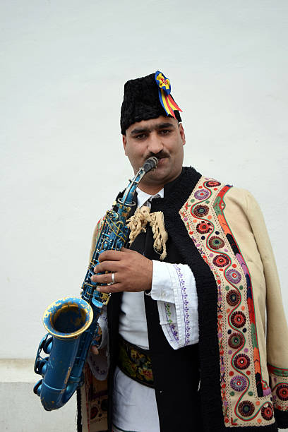 istock Gipsy singing traditional Romanian carols at saxophone. 503399816