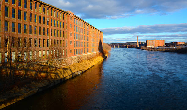 Mill Buildings Lawrence Taken in the historic mill building area of Lawrence, MA near the Merrimack river. lawrence kansas stock pictures, royalty-free photos & images