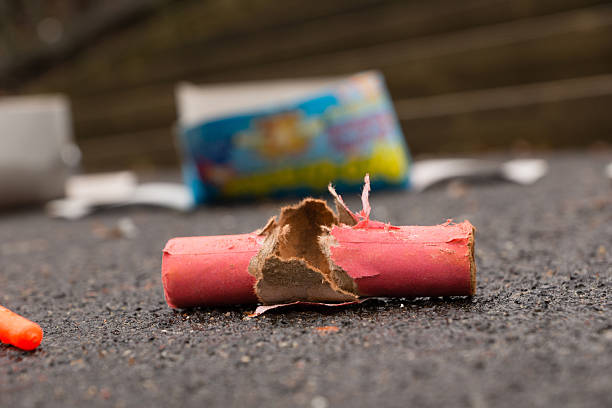 Firecracker Waste of burnt firecrackers on the street firework explosive material photos stock pictures, royalty-free photos & images