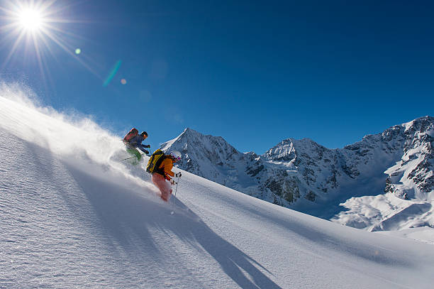 istock skitouring downhill - powder skiing 503400522
