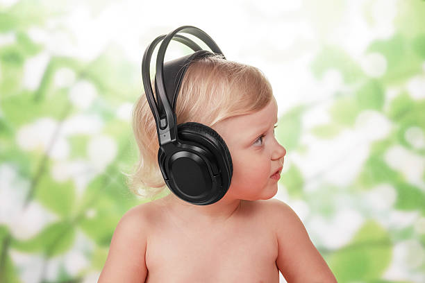 istock Little baby with headphones 503401851