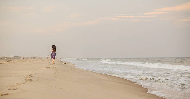 istock Girl running at the beach 503402287