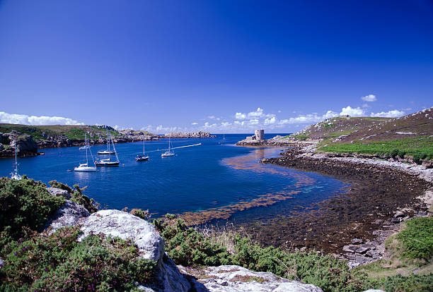 Blue water Sheltered water between the islands of Brhyer and Tresco isles of scilly stock pictures, royalty-free photos & images