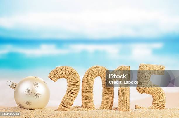 New Year Sign And Christmas Ball Stock Photo - Download Image Now - 2015, Beach, Celebration