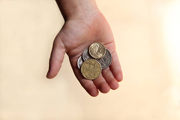 Pocket Money A boy holding Australian Money allowance stock pictures, royalty-free photos & images