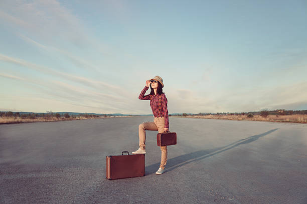 istock Traveler hipster woman looks through binoculars 503405893