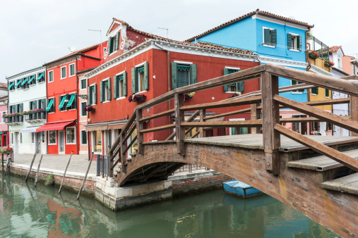 Colorful houses with wooden bridge in Burano Island at Venice, Italy. 