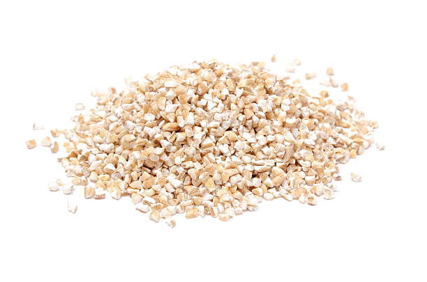 istock Heap of barley groats isolated on white background 503406673