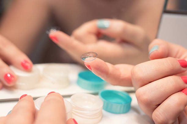 istock Female hands holding lens 503417174