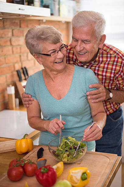 istock Senior couple preparing fresh salad together 503417240