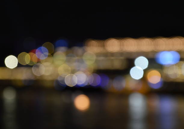 istock blurry of artificial light background on pier 503417254