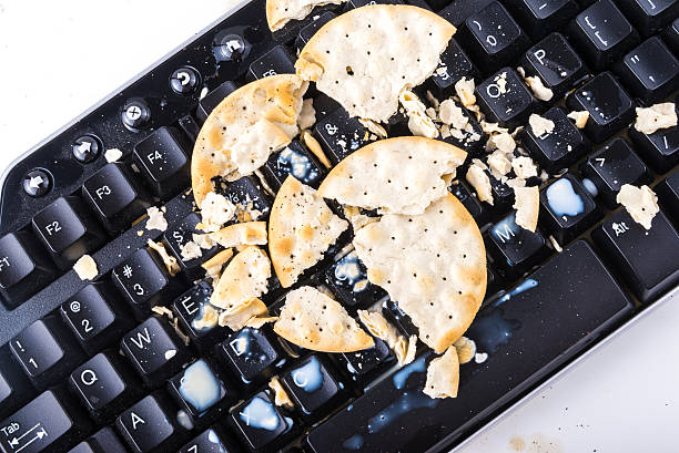 Crackers on the keyboard Broken cracker will make your keyboard broken too messy vs clean desk stock pictures, royalty-free photos & images