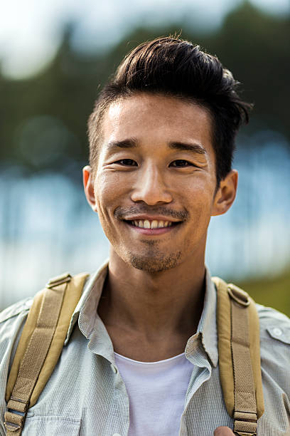 istock Smiling male backpacker in forest 503417398