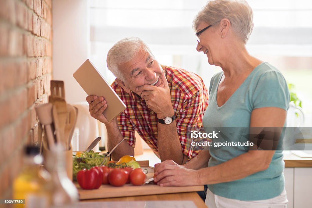 Modern senior couple spending time in the kitchen Healthy Eating Stock Photo