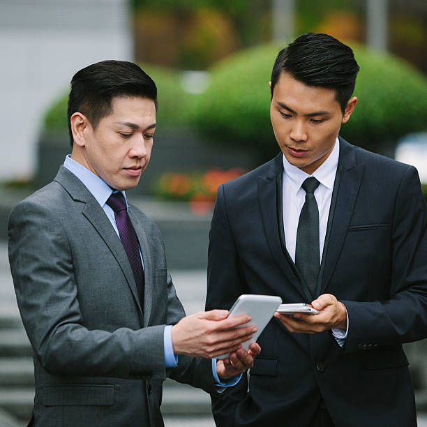 istock Businessmen with smartphones 503417908