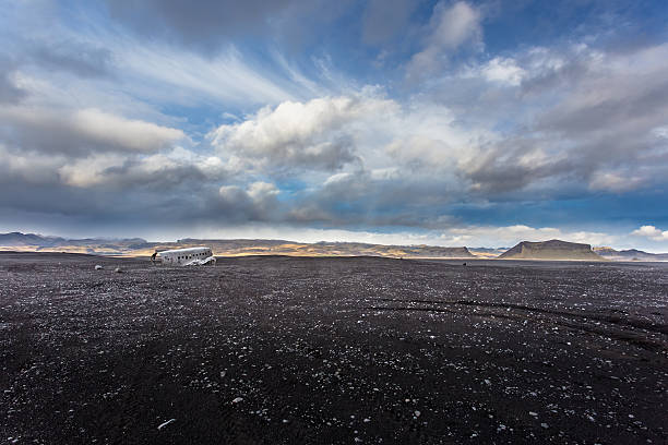 istock Airplane wreckage on black sand beach 503418824