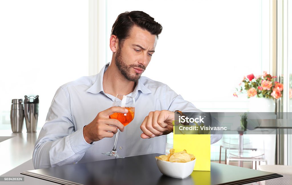 man waiting for woman late to date Alcohol - Drink Stock Photo