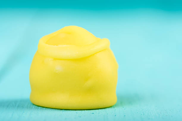 Yellow Fondant Candy On Turquoise Background