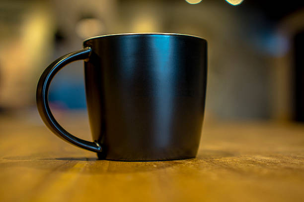 istock black coffee cup on wooden table 503424570