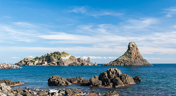 istock Island Lachea and a sea stack, in Acitrezza (Sicily) 503425114