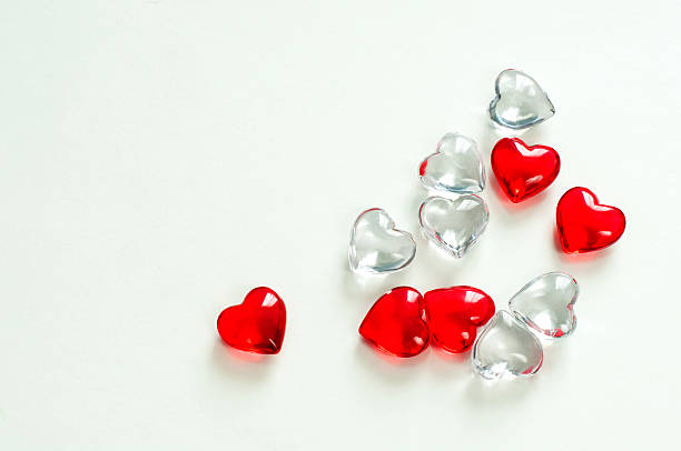 istock Glass hearts on white background 503425484