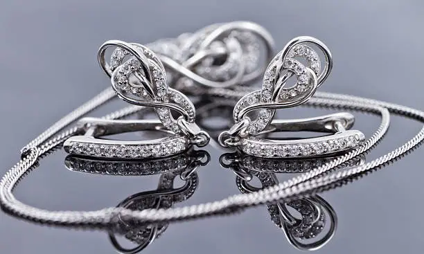 Photo of Elegant silver earrings in the shape of a horseshoe