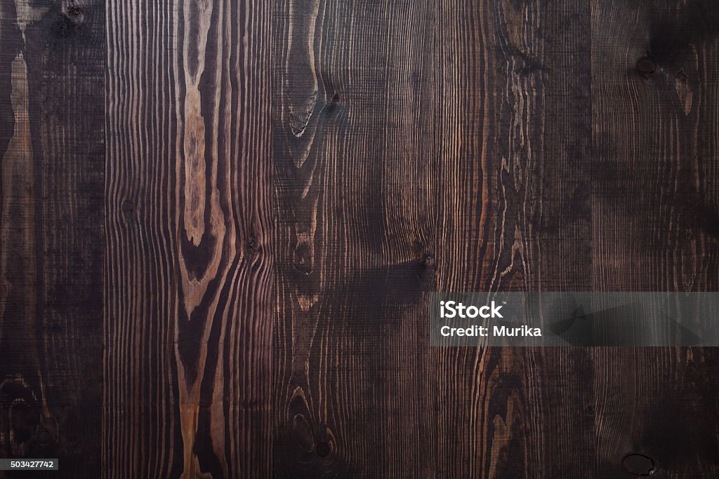 Dark brown wooden plank background Dark brown wooden plank background, vintage and retro Backgrounds Stock Photo