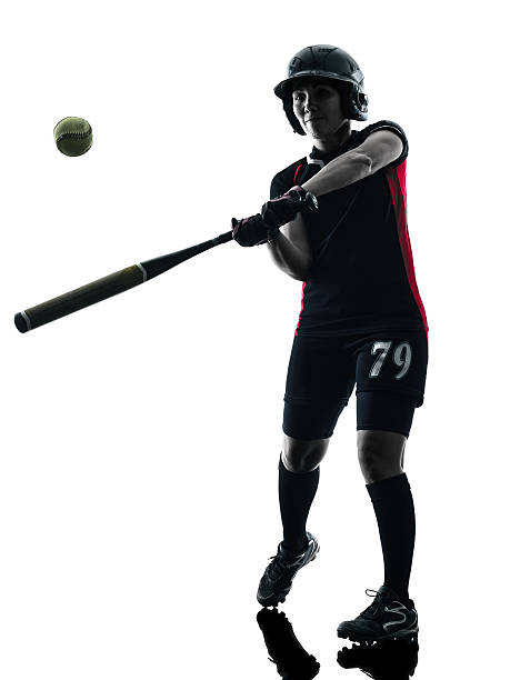 istock woman playing softball players silhouette isolated 503428236