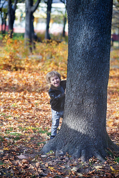 istock Happy kid having fun in park in autunm. 503428352